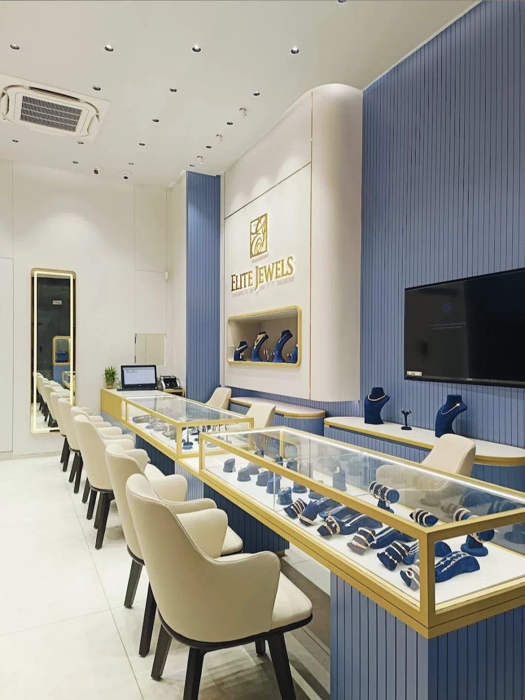 Long glass counters of rings and bracelets with seating for clients