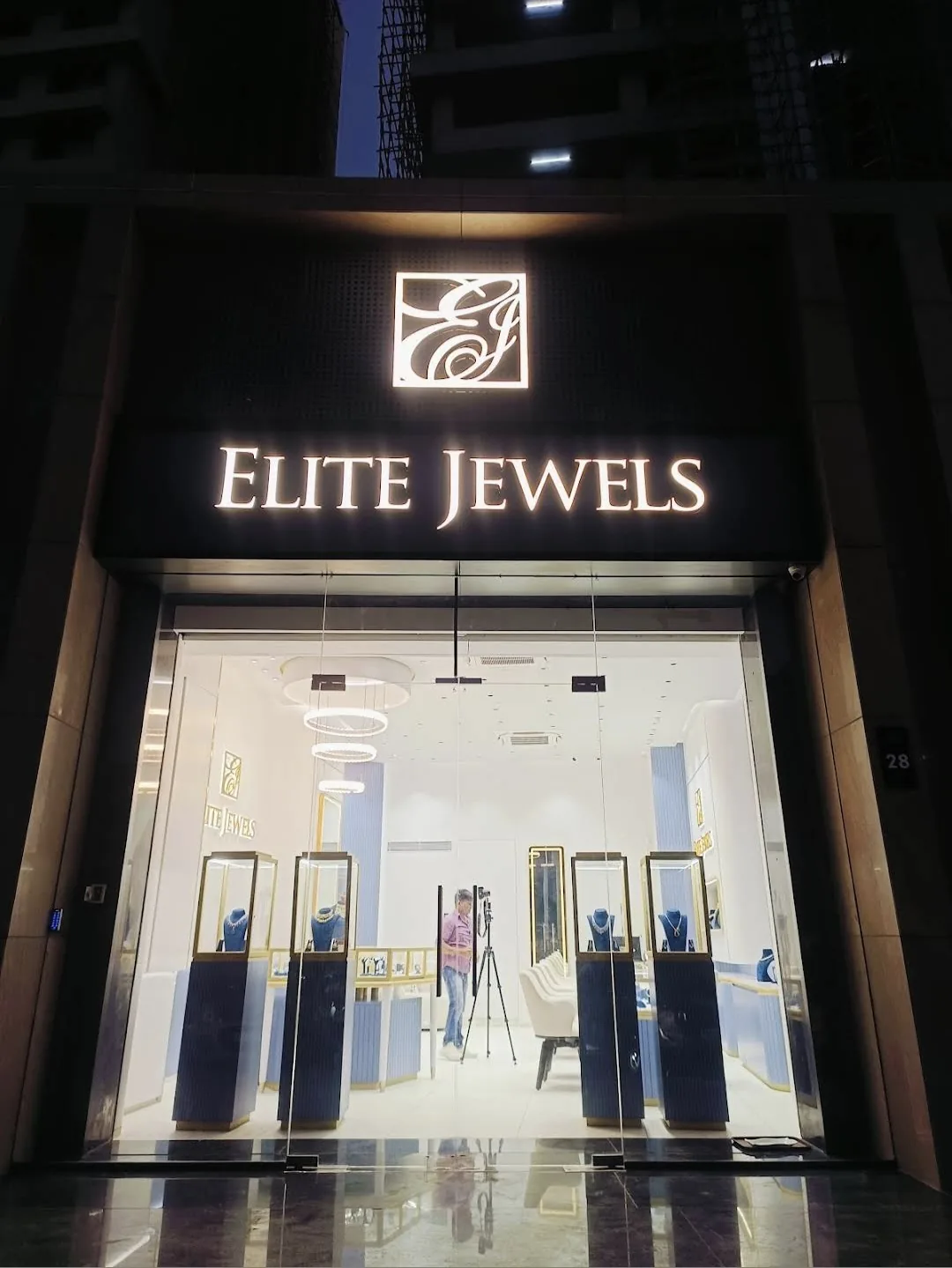 The Elite Jewels shopfront at night, Shop No. 28, Roongta Estella, University Road, Surat